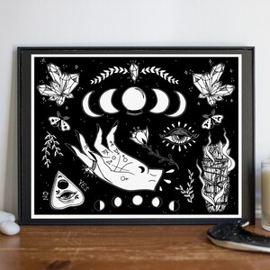 May include: Black and white print of a mystical hand with a ring, surrounded by moons, crystals, a burning sage bundle, an eye, and a Ouija board with the words "YES" and "NO".