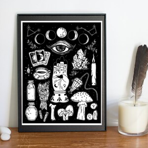 May include: Black and white illustration of various witchcraft and occult symbols on a black background. The illustration includes a hand with astrological symbols, a crescent moon, a crystal, a candle, a mushroom, and a tarot card.