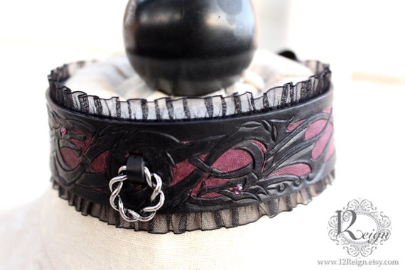 Fetish leather collar- intertwined Dragon design. Featuring petite collar ring, Swarovski gem eyes and ribbon closure