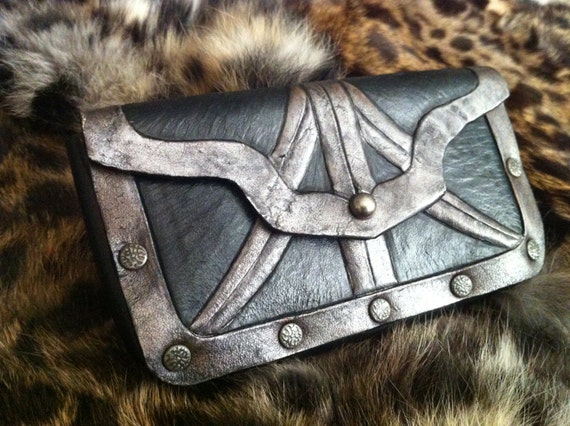 The Assassin- tooled leather case...for when you prefer phone, ID and cash be carried on a belt next to your dagger.