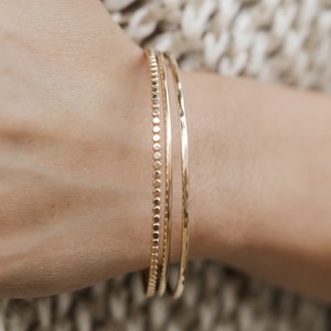 Woman wearing gold bangles