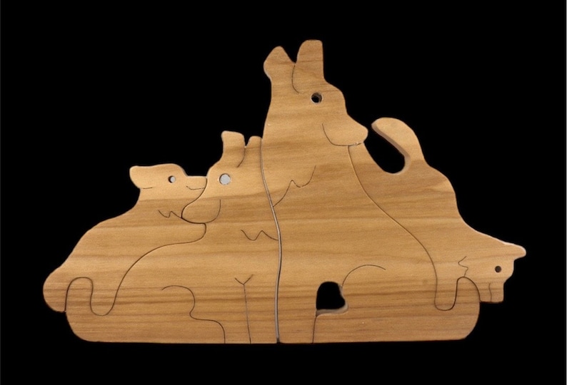 May include: Wooden puzzle featuring four animals, a cat, a dog, and two wolves. The puzzle pieces fit together to form a larger image.