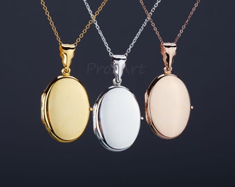 May include: Three oval-shaped lockets on chains. The lockets are gold, silver, and rose gold.