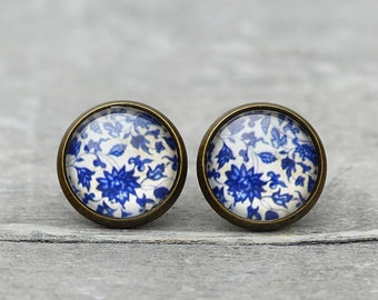 Studs with old porcelain Scene