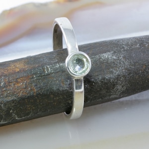 Ring with blue topaz and silver