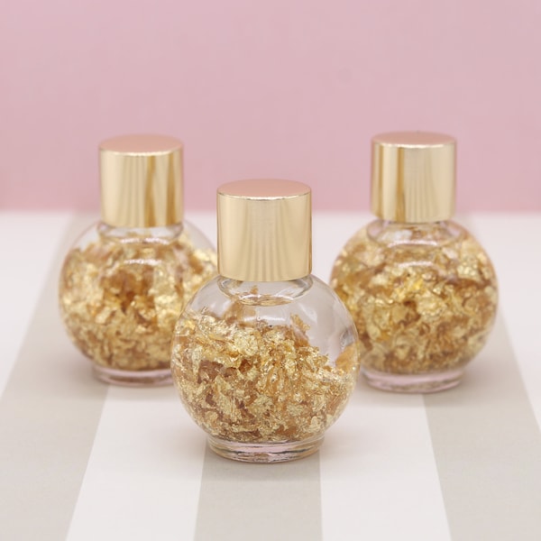 Gold Flakes in Glass Bottle