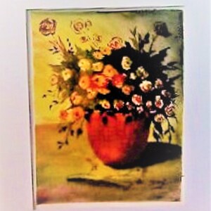 May include: A painting of a bouquet of pink, white, and yellow flowers in a red vase. The flowers are arranged in a loose, natural style, and the vase is sitting on a table with a yellow tablecloth.