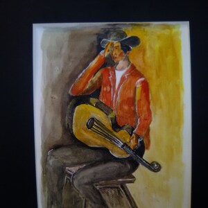 May include: A watercolor painting of a person wearing a red jacket and a black hat, sitting on a stool and playing a guitar. The background is a yellow and brown gradient.