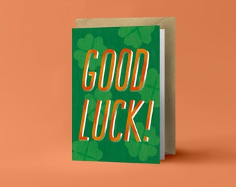 Good Luck! - Orange Typography on Green Clovers - Folded Greeting Card - Postcard with Kraft Envelope