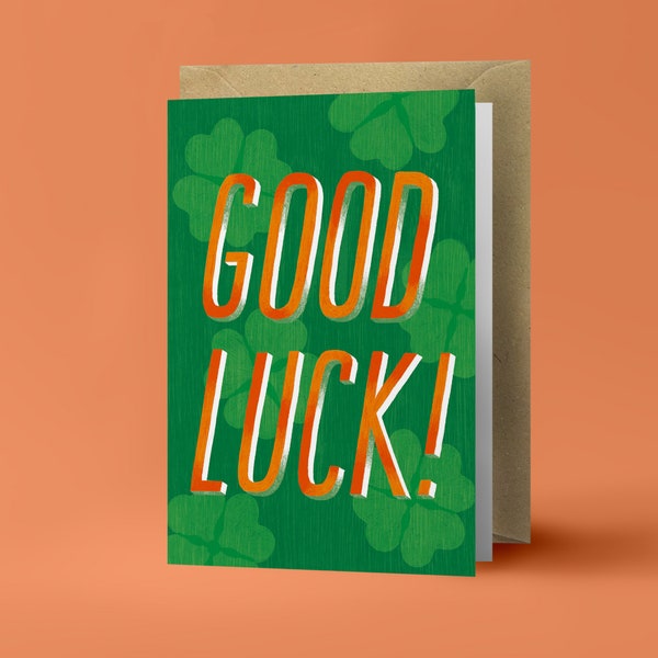 Good Luck! - Orange Typography on Green Clovers - Folded Greeting Card - Postcard with Kraft Envelope