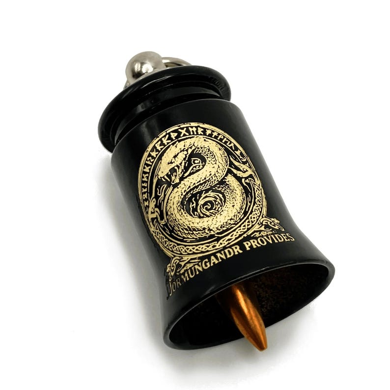 May include: Black bell-shaped object with a gold serpent design and the text "JOR MUNGANDR PROVIDES". The bell has a silver top and a copper-colored striker. The serpent design is surrounded by runes.
