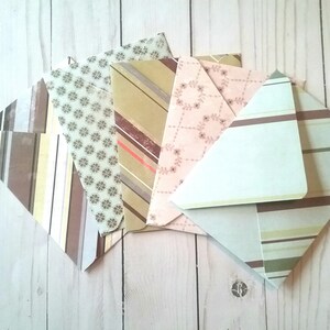 May include: Pack of six patterned envelopes with a variety of designs, including stripes, floral, and geometric patterns. The envelopes are in shades of brown, beige, pink, and green.