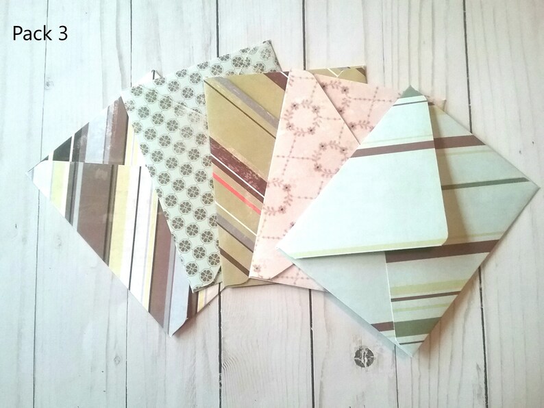 May include: Pack of six patterned envelopes with a variety of designs, including stripes, floral, and geometric patterns. The envelopes are in shades of brown, beige, pink, and green.