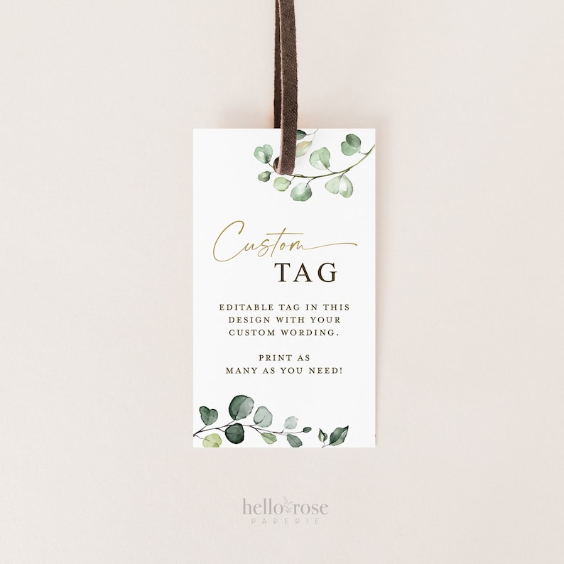 May include: A white card with a green eucalyptus branch design and gold text that reads "Custom TAG". The text below reads "Editable tag in this design with your custom wording. Print as many as you need!" and "hello rose PAPERIE".