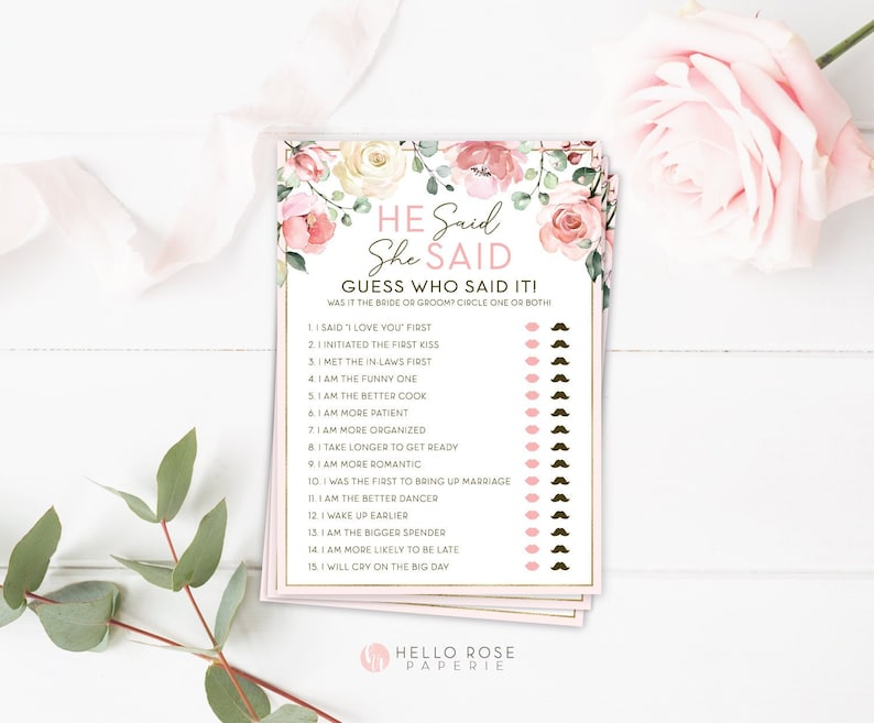 May include: A pink and white floral themed printable bridal shower game card with the text "He Said She Said Guess Who Said It!" and a list of 15 questions for guests to guess who said it, the bride or the groom.