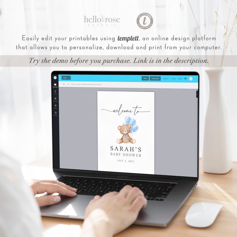 May include: A laptop displays a baby shower sign with a teddy bear and blue balloons. The sign reads "Welcome to Sarah's Baby Shower, July 2, 2025." The text "hello rose PAPERIE" is at the top. The screen also displays text about editing printables.