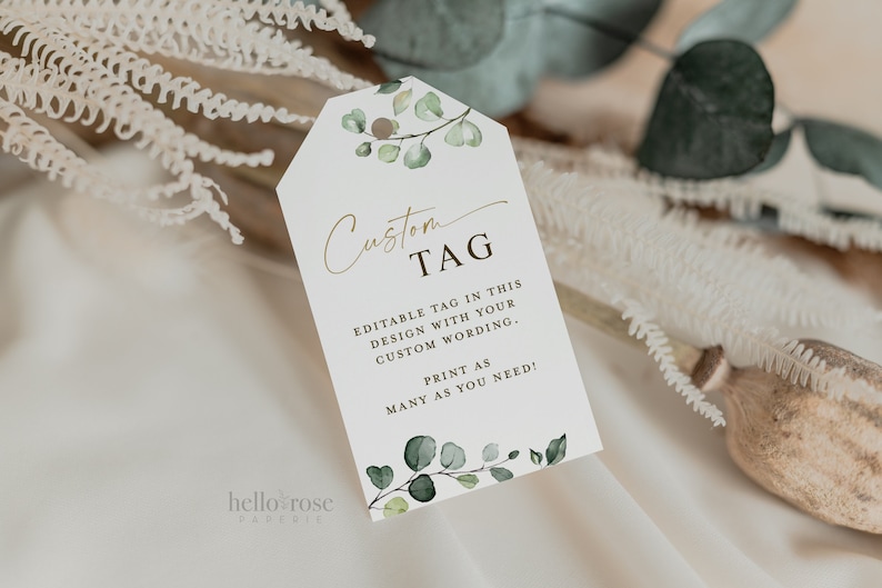 May include: A white tag with a gold script font that says "Custom TAG". The tag has a green watercolor floral design with the text "Editable tag in this design with your custom wording. Print as many as you need!"