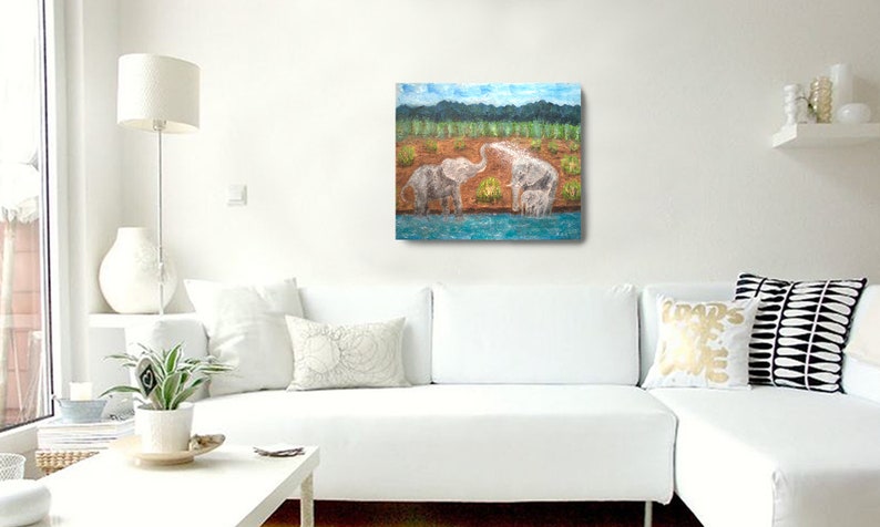 May include: A painting of two elephants playing in a blue pond with green trees in the background.