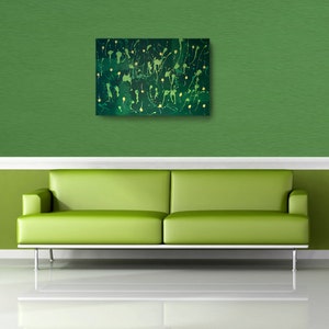 May include: Abstract painting with green and gold paint splatters on a canvas. The painting is hanging on a green wall above a green sofa.