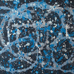 May include: Abstract painting with blue, silver, and white paint splatters on a black background. The paint is applied in a random, chaotic pattern, creating a sense of movement and energy.