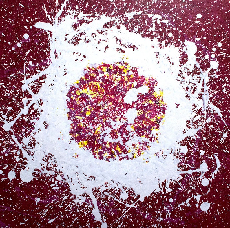 May include: Abstract painting with a white splatter pattern on a deep red background. A smaller circle of yellow, red, and purple paint is in the centre of the white splatter.