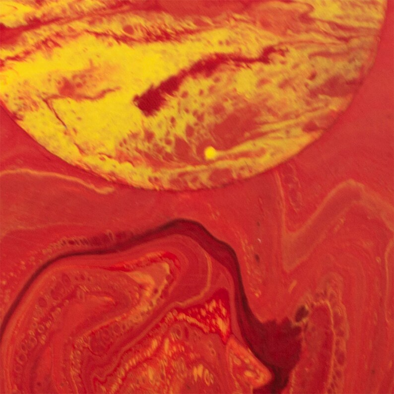 May include: Abstract painting with swirling red, orange, and yellow paint. The colors are vibrant and create a dynamic composition.