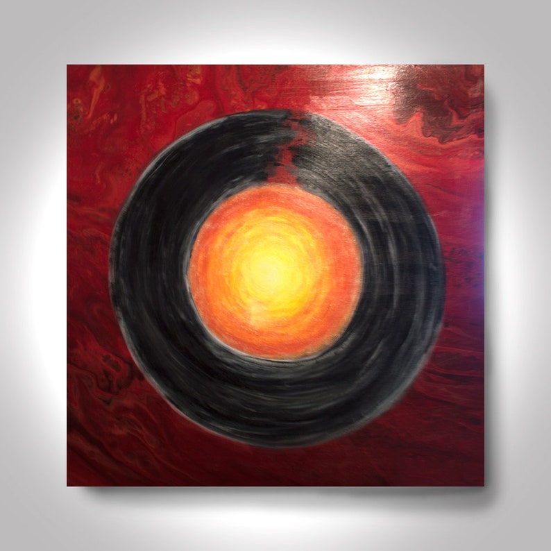 May include: Abstract painting with a black circle in the center, surrounded by a red background with orange and yellow swirls. The circle has a bright yellow center with orange and red swirls.