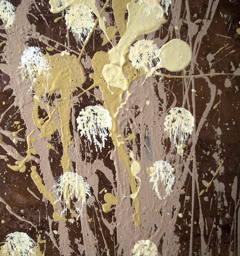 May include: Abstract art painting with brown, beige, and white paint splatters. The paint is applied in a random pattern, creating a dynamic and textured surface.