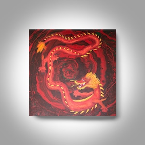 May include: A red and gold Chinese dragon painting on a dark red background. The dragon is curled up in a circle, with its head facing the viewer. The dragon has sharp teeth and claws, and its scales are painted in a detailed manner.