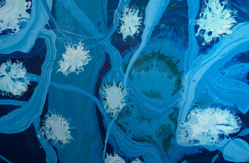 May include: Abstract painting with blue and white paint. The white paint is in the shape of flowers.