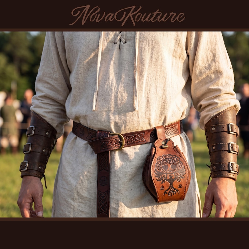 May include: A person wearing a light-colored tunic with a brown leather belt, pouch, and arm guards. The belt and arm guards have buckle details. The pouch features a tree of life design. The text "Nova Kouture" is at the top.