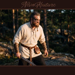 May include: A person wearing a cream-colored tunic, brown leather belt, and arm bracers, holding a sword. The outfit includes a leather pouch and is set against a forest backdrop. The text "Nova Kouture" is at the top.