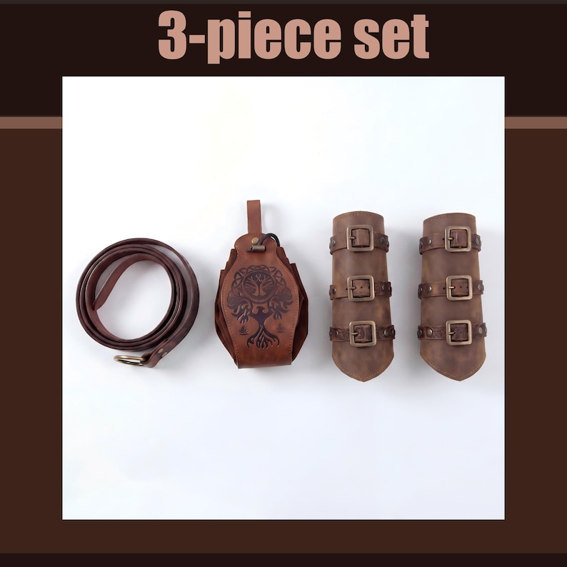 May include: A brown leather 3-piece set. The set includes a rolled belt with a gold buckle, a pouch with a tree design, and two arm cuffs with buckles. The text "3-piece set" is at the top.