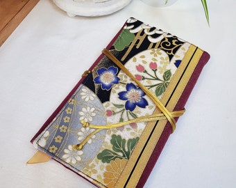 Adjustable paperback book cover with integrated Japanese cotton bookmark, a book cover that fits all paperback books