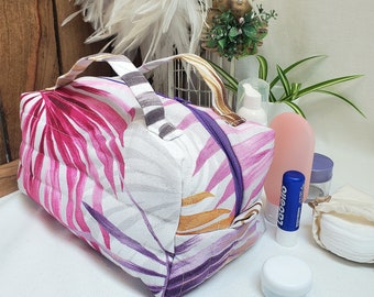 Quilted toiletry bag in tropical foliage cotton and lined with polka dot coated cotton