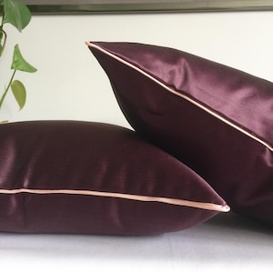 Dark purple cushion or cover. Aubergine cushion with piping.
