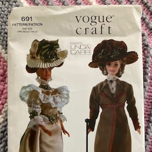 May include: A vintage Vogue Craft sewing pattern for making doll clothes. The pattern is for a doll outfit from the early 1900s. The pattern includes instructions for making a dress and a coat. The pattern is designed by Linda Carr.