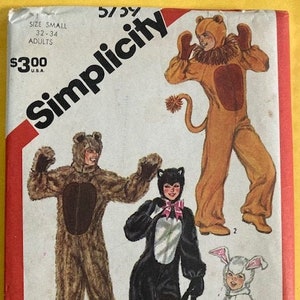 May include: Simplicity sewing pattern for making animal costumes. The pattern includes instructions for making a lion, bear, cat, and bunny costume. The pattern is for sizes 32-34 for adults.