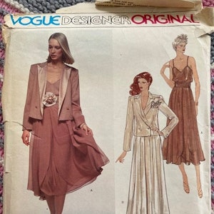 May include: Vintage Vogue Designer Original sewing pattern for a dress with a wrap skirt and a blazer. The pattern is by Gianni Versace for Jenny and is number 2026.