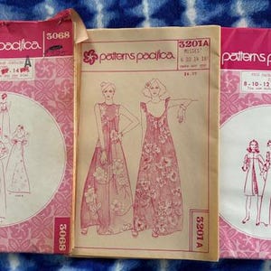 May include: A white ceramic mug with a black handle and the text "But First, Coffee" in a handwritten style. The mug is on a white surface. The mug is approximately 4 inches tall.