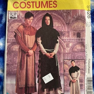 May include: McCall's Costumes sewing pattern number 9426 for a monk costume. The pattern includes instructions for making a brown robe with a hood and a black robe with a hood. The pattern is for sizes small, medium, and large.
