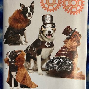 May include: Simplicity sewing pattern number 1031 for making steampunk-themed dog costumes. The pattern includes three different designs: a brown fur-trimmed coat, a brown leather vest with gears, and a red and black vest with a zebra-print skirt. The pattern is designed for dogs in sizes S-L.