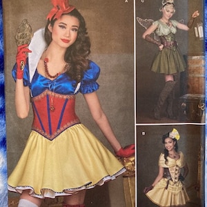 May include: A sewing pattern for three different costumes: a fairy, a steampunk-inspired outfit, and a Snow White-inspired dress. The pattern is from Simplicity and is size 6-14, 32-40 Euro, and 34-42 French.