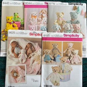 May include: A collection of five Simplicity sewing patterns for stuffed animals, including bears and rabbits. Each envelope features photographs of finished plush toys in various fabrics, colors, and outfits, with pattern numbers 8442, 8044, 8716, 3625, and 8155 printed on the front.