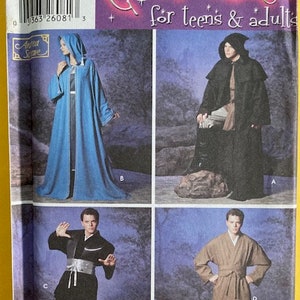 May include: Simplicity pattern 5840 for costumes for teens and adults. The pattern includes four different costumes: a blue hooded robe, a black hooded cloak, a black martial arts outfit, and a brown robe with a sash.