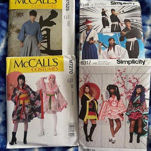 May include: Four costume pattern envelopes. Two are labeled "McCall's Costumes" and feature illustrations of Japanese-style outfits. The other two are "Simplicity" patterns, also depicting Japanese-inspired costumes. The patterns include images of kimonos and traditional attire.