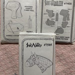 May include: Three vintage sewing patterns for equestrian gear. The patterns include designs for a western saddle carry bag, bridle, saddle cover, and horse hood. The patterns are labeled "SuitAbility" with different item numbers and sizes.