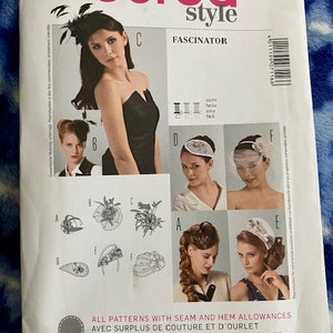 May include: A sewing pattern for a fascinator, a type of hat. The pattern includes instructions for making six different styles of fascinators. The pattern is from Burda Style and is labeled "Fascinator".