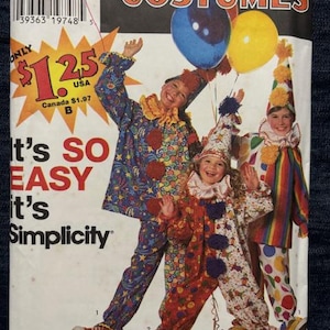 May include: A Simplicity sewing pattern envelope for costumes, model 9698, featuring three children wearing colorful clown outfits with ruffled collars, hats, and pom-poms. The packaging displays the text 'Simplicity COSTUMES' and 'It's SO EASY it's Simplicity' along with a barcode and size information for sizes 2-4, 6-8, and 10-12.