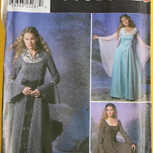 May include: Simplicity Costumes pattern featuring medieval-style dresses. The image shows three different dress designs, including a long-sleeved gray dress with a black belt and a blue dress with flowing sleeves. The pattern number is 9891.